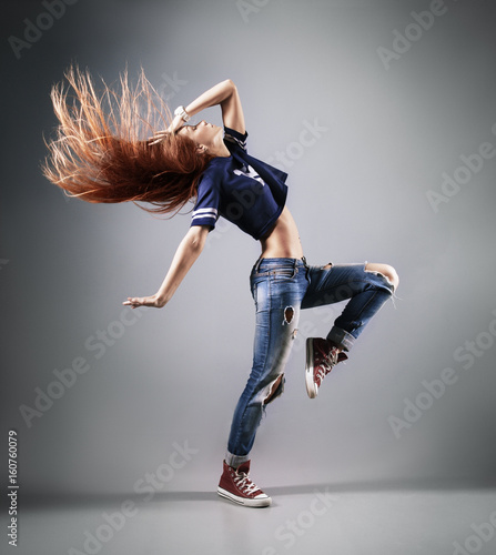 Canvas Print modern young beautiful dancer posing on a studio background