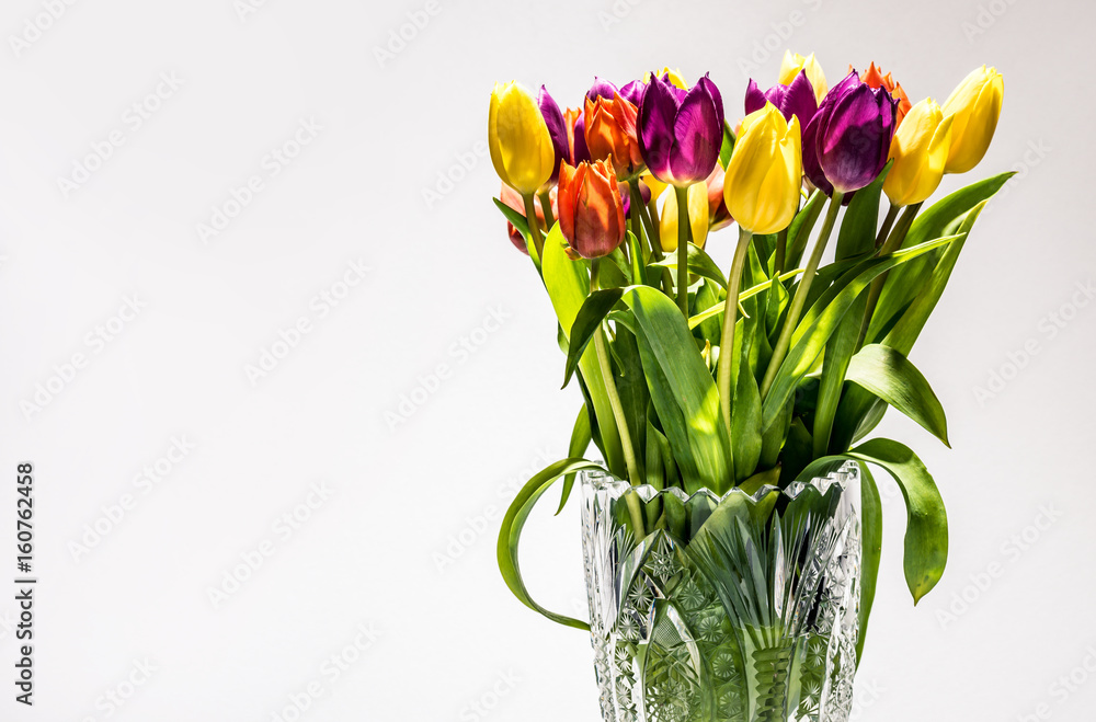 Tulip flowers in a glass pot