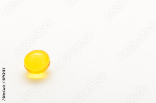 Contraceptive pills without packaging on a light background.
