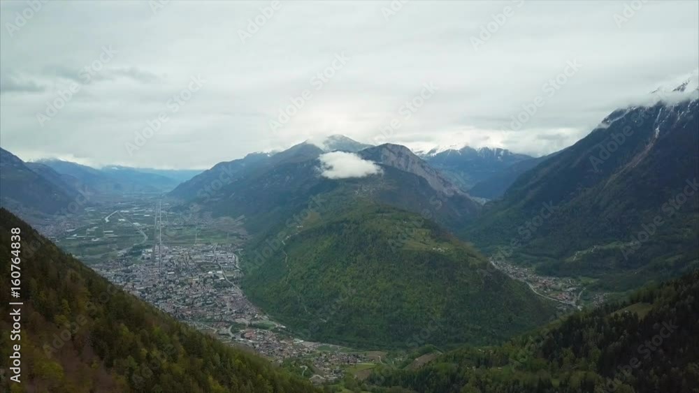 Amazing Aerial View of Small Town, Valley and Mountains in Switzerland at Summer Time Amazing Aerial View of Small Town, Valley and Mountains in Switzerland at Summer Time
