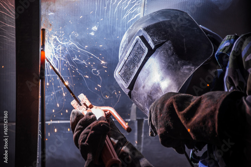 Arc welding of a steel in construction site photo