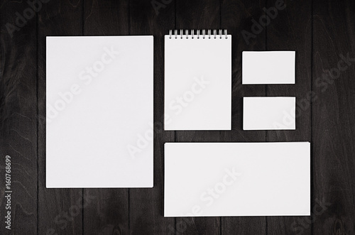 Branding stationery, mockup scene on black wooden plank, blank objects for placing your design photo