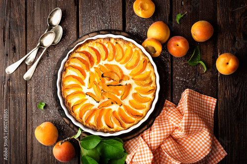 Apricot cake or pie with fresh fruits, cheesecake photo