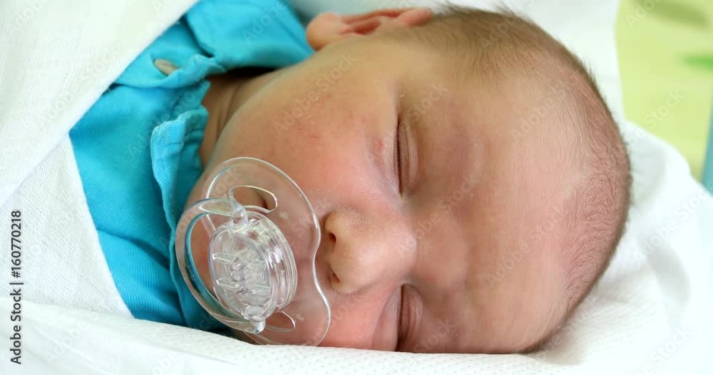 newborn baby infant in the hospital, the first hours of the new life ...
