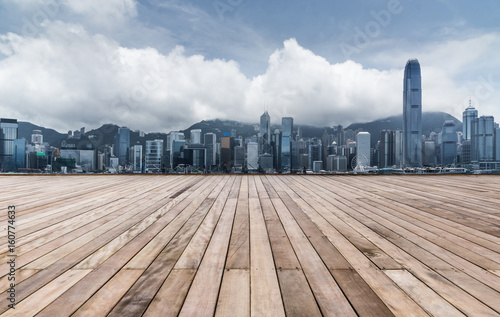 empty wooden platform with Shanghai skyline in background.