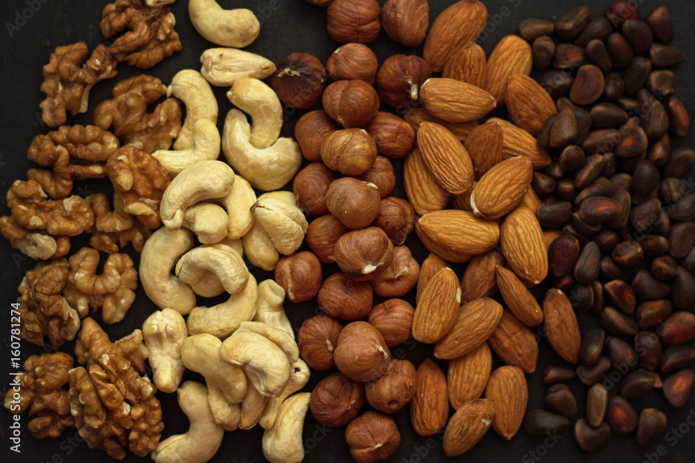 close up rows of nuts on the table , top view. close up rows of nuts on the table , top view.