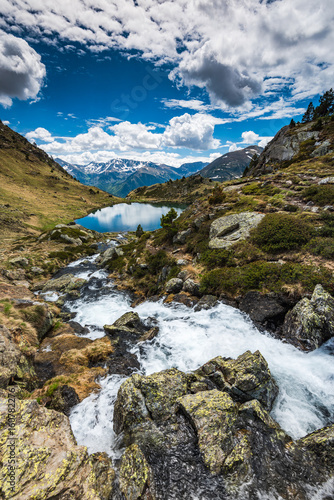 Fototapeta Naklejka Na Ścianę i Meble -  Stream flowing towards lake Tristaina,Andorra