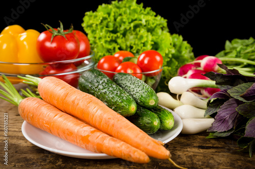 Assortment of vegetables on wooden table