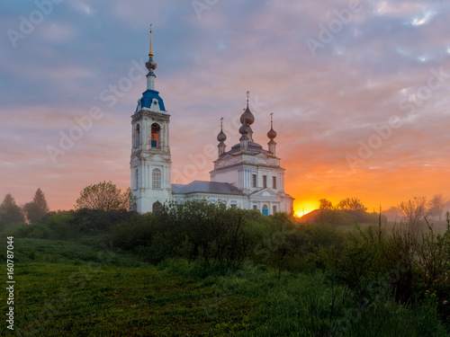 Foggy sunrise in the village Savinskoye, Yaroslavl region. Russia. The Church Of The Nativity Of The Blessed Virgin.  © yulia_terekhina