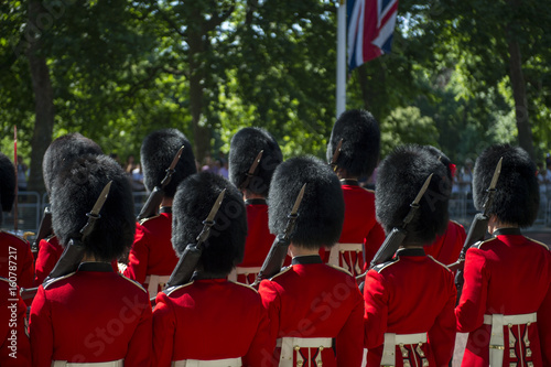 Photo Soldiers in classic red coats line up in formation on The Mall in London, England during Trooping the Colour spectacle to celebrate the Queen's birthday
