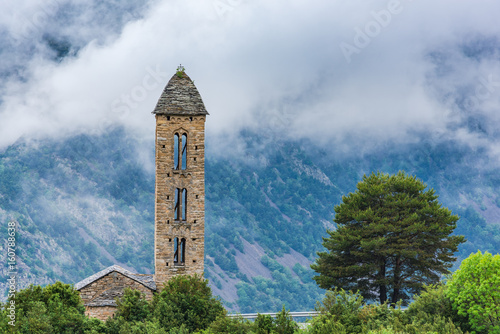 Clouds over Sant Miquel Engolasters church,Andorra photo