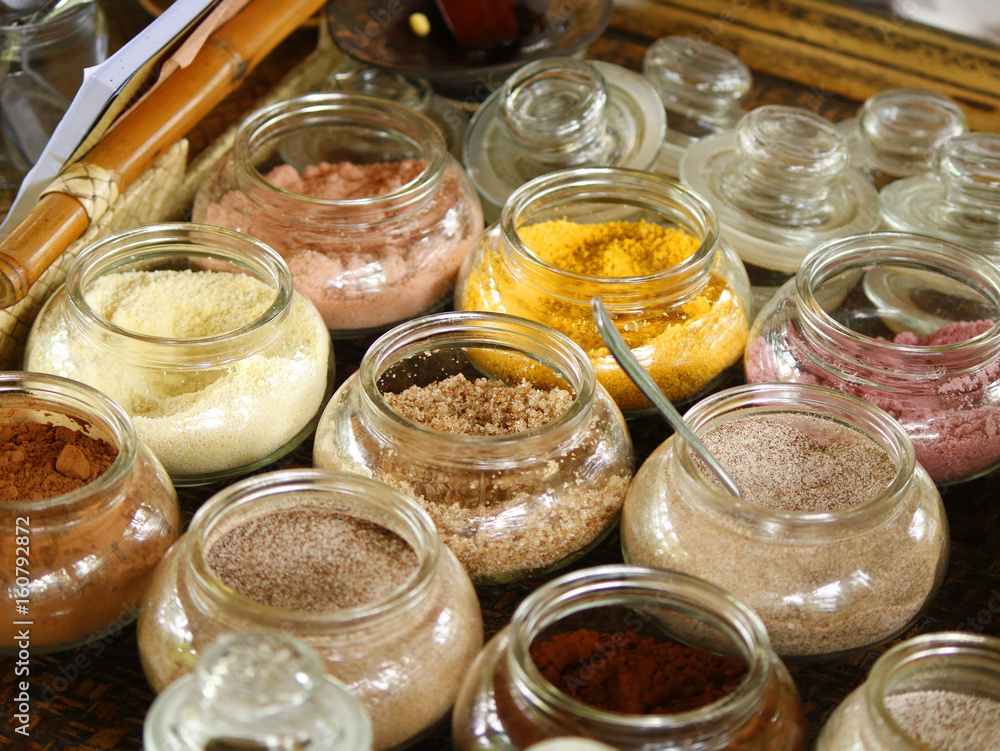 Small glass jars with various differently colored ingredients Small glass jars with various differently colored ingredients