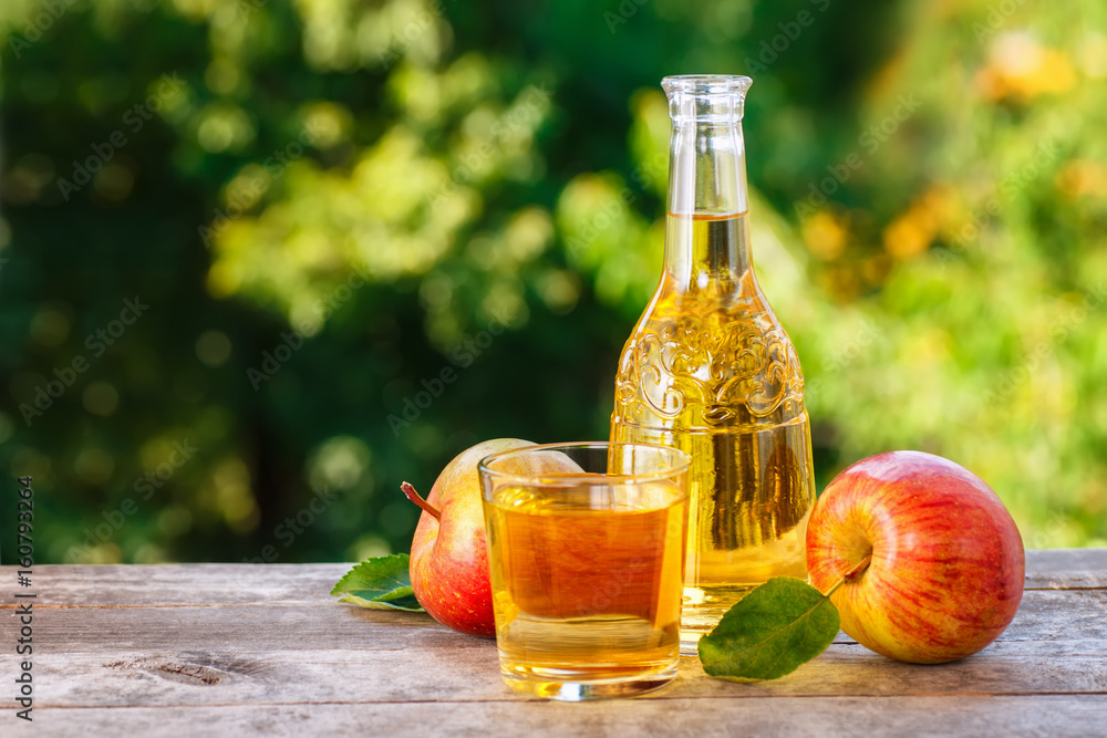 apple cider on wooden table apple cider on wooden table
