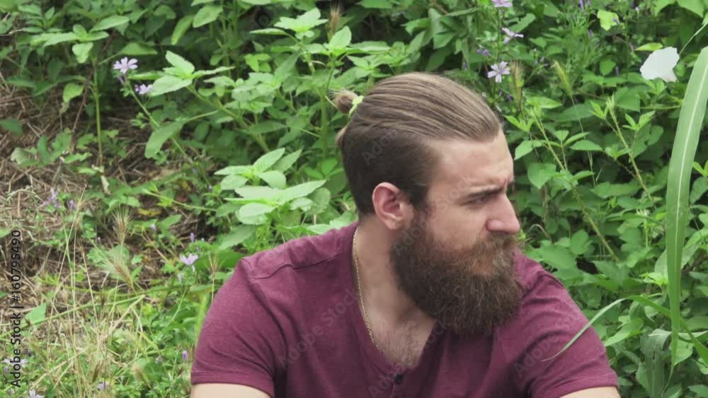 Hipster Man waiting on sidewalk Hipster Man waiting on sidewalk