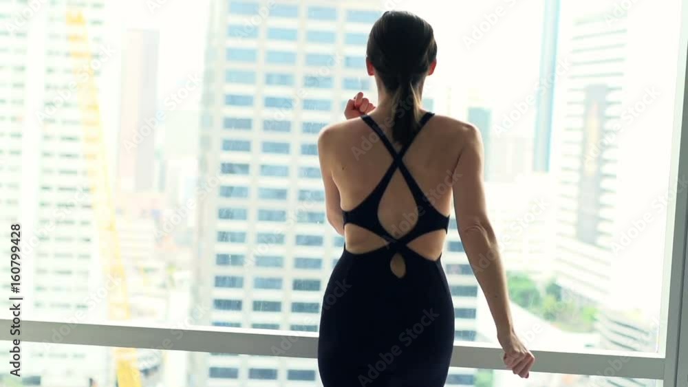 Woman doing warmup, running by window in gym, super slow motion 120fps Woman doing warmup, running by window in gym, super slow motion 120fps