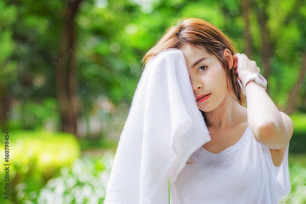 The girl is jogging with white cloth. The girl is jogging with white cloth.