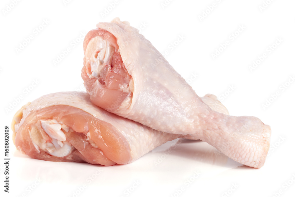 Two raw chicken drumsticks isolated on white background Two raw chicken drumsticks isolated on white background