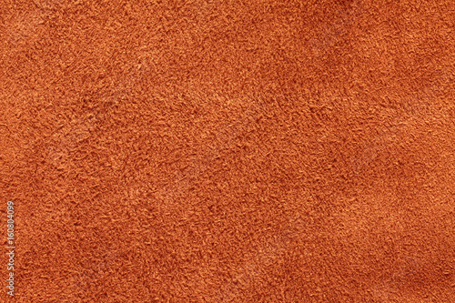 Orange suede texture background, closeup, long fiber