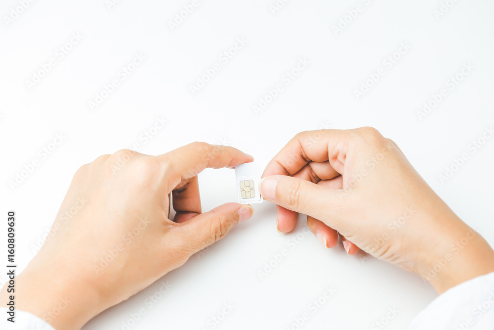 Hand holding sim card, select focus, color effect Hand holding sim card, select focus, color effect