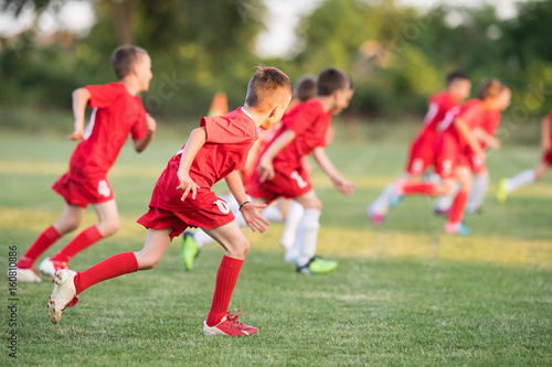Kids soccer football - children players exercising before match on soccer field © Dusan Kostic