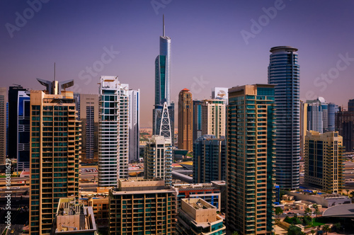 Amazing colorful dubai marina skyline with water canal and expensive yachts, Dubai, United Arab Emirates.