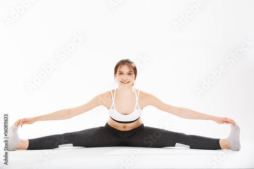 Young woman exercise yoga supported headstand