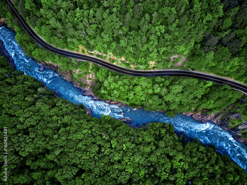 Mountain river and road aerial view