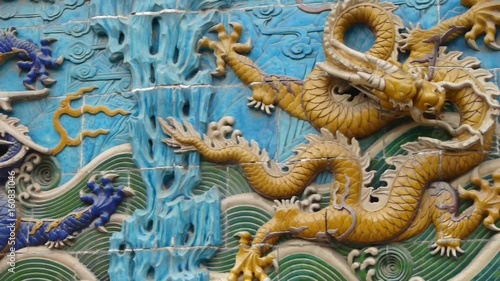 china royal nine dragon wall,stone dragon totem in forbidden city. photo