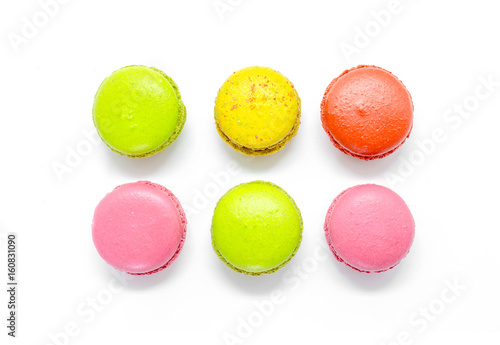 Colorful macaroons on white background.
