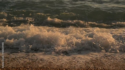 Waves on the Adriatic Sea, sunset, slow motion photo