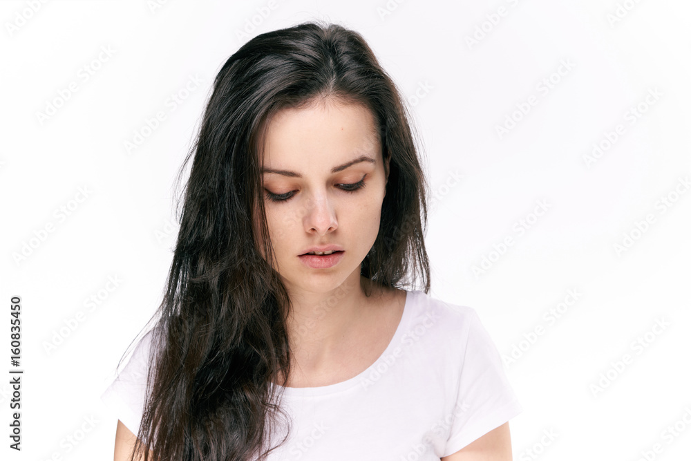 Woman looking down, woman on isolated background Woman looking down, woman on isolated background