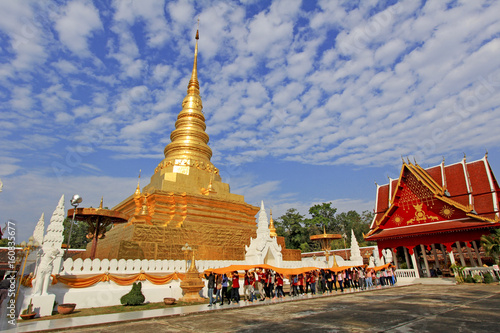 The yellow cloth was brought to temple to be wrapped around the pagoda. Phra That Cho Hae Temple, the Royal Temple, is a sacred ancient temple in Phrae Province of Thailand 