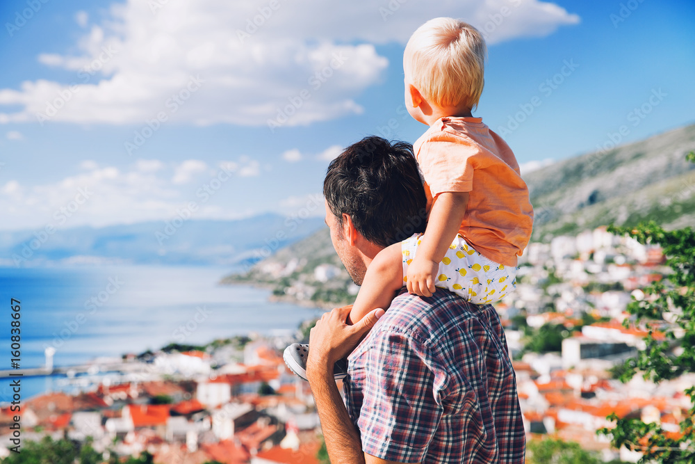 Fototapeta premium Father and son on backgrounds of the Croatian seacoast.