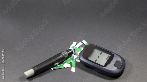 checking blood glucose for treatment studio image