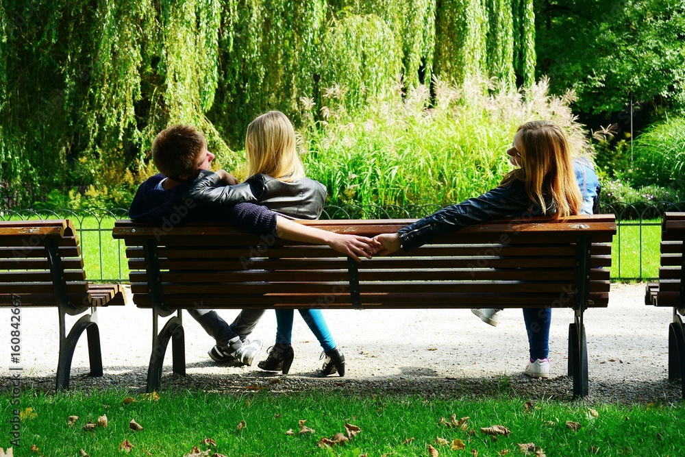 Love triangle in Vilnius town Bernardinu garden on autumn
