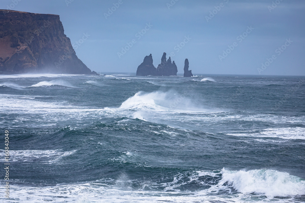The Reynisdrangar basalt cliffs near Vik, Iceland, during a storm
