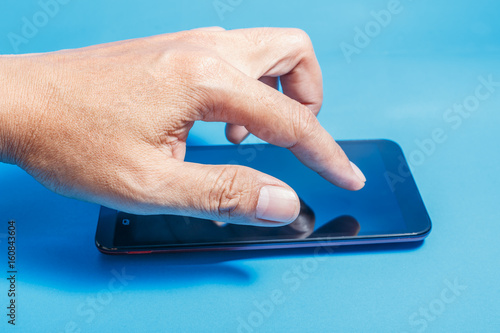 Hands of men press on touch screen digital smartphone