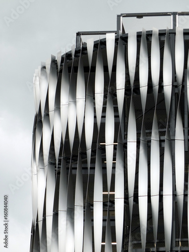 corner of a modern steel building with geometric surface