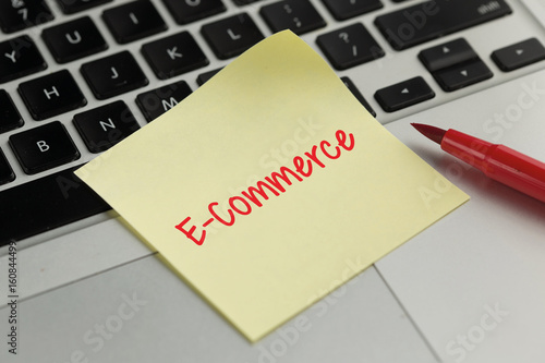 E-Commerce sticky note pasted on the keyboard