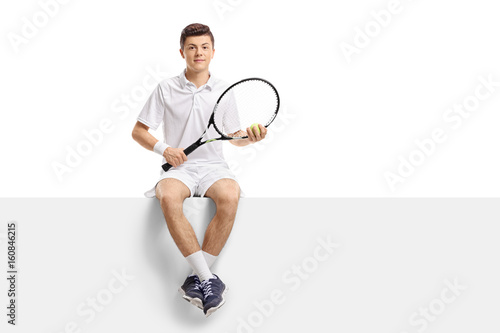 Teenage tennis player sitting on a panel