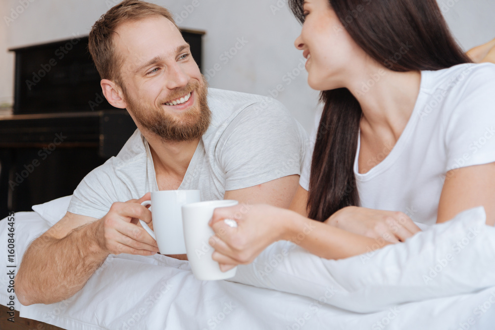 Adorable couple having breakfast in bed Adorable couple having breakfast in bed