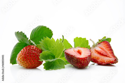 Fresh, ripe, juicy and mouth-watering strawberries with green leaves