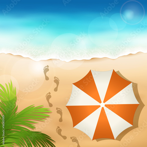 Sandy beach with a beach umbrella