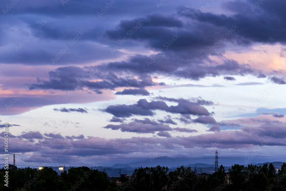 A lot of Clouds during sunset at Parma, Italy 