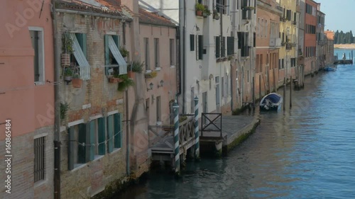 Romantic tour in gondola, rowed by a gondolier in the venice canal. photo