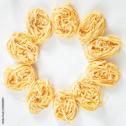 Italian Fettuccine nest pasta on light background