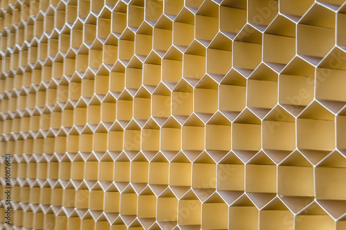Orange metal honeycomb grid backgroundgrid. Abstract texture.
