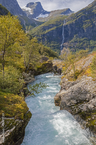 Picturesque mountain valley with turbulent river near Briksdal glacier, Norway