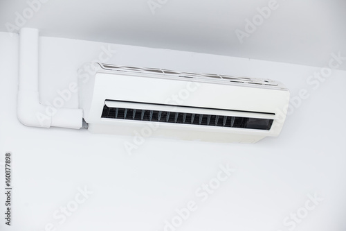 Air conditioner on wall background © neosiam