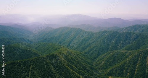 Flight over the cedar valley. landscape of mountains in the mist Cyprus.Drone Point of View Platres in the Troodos. Cyprus. Aerial View. Flying over the mountains 
